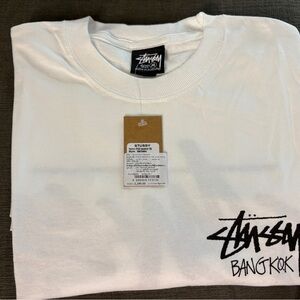 Stussy White Graphic Tee with Bangkok Logo